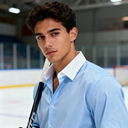 Person wearing a light blue shirt on an ice rink